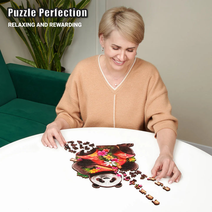 Woman building 200-piece wooden puzzle with panda art and nature-shaped wooden pieces