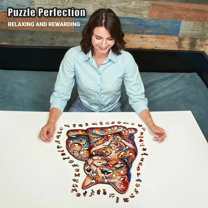 Woman assembling 500-piece cat mosaic puzzle with vibrant shapes and complex design, relaxing fun