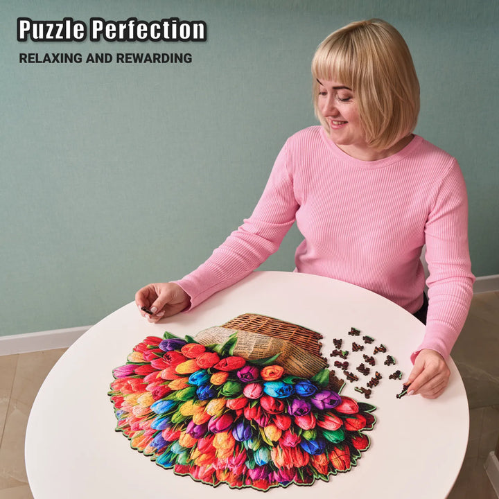 Woman assembling 500-piece Flowers puzzle at table with vivid tulips and nature-inspired shapes