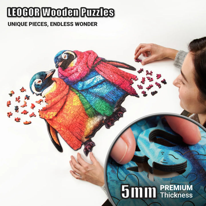 Close-up of 5mm wooden penguin puzzle piece mid-assembly, showing vibrant art and precision cut