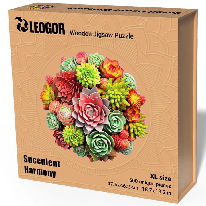 Finished 500-piece Succulent Harmony puzzle beside vivid floral box and whimsical wood cuts