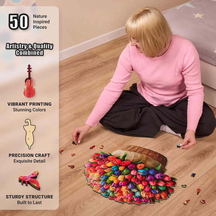 Woman assembling 500-pcs tulip bouquet puzzle on floor, surrounded by colorful flower-shaped pieces