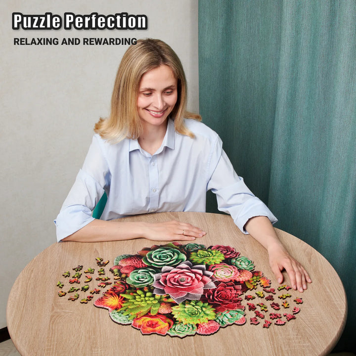 Woman assembling 500-piece succulent puzzle at table with floral shapes and vivid wood pieces