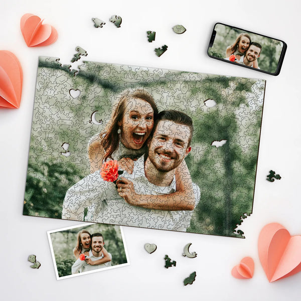 Happy couple with a flower, shown as personalized jigsaw puzzles with scattered pieces and hearts