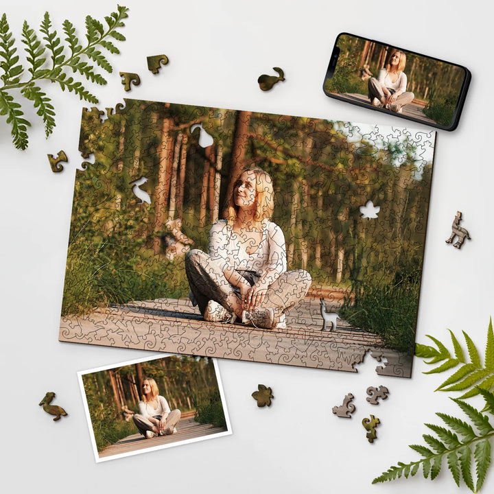 Woman on a forest path, shown as custom photo puzzle with scattered pieces and nature elements