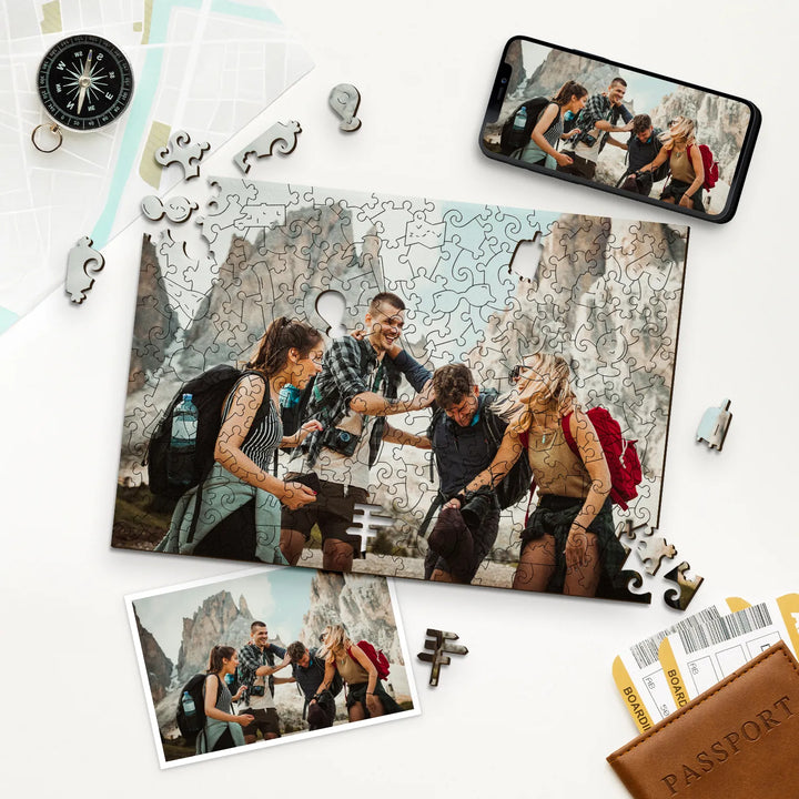 Friends with backpacks in front of mountains, shown as personalized puzzle with compass & passports